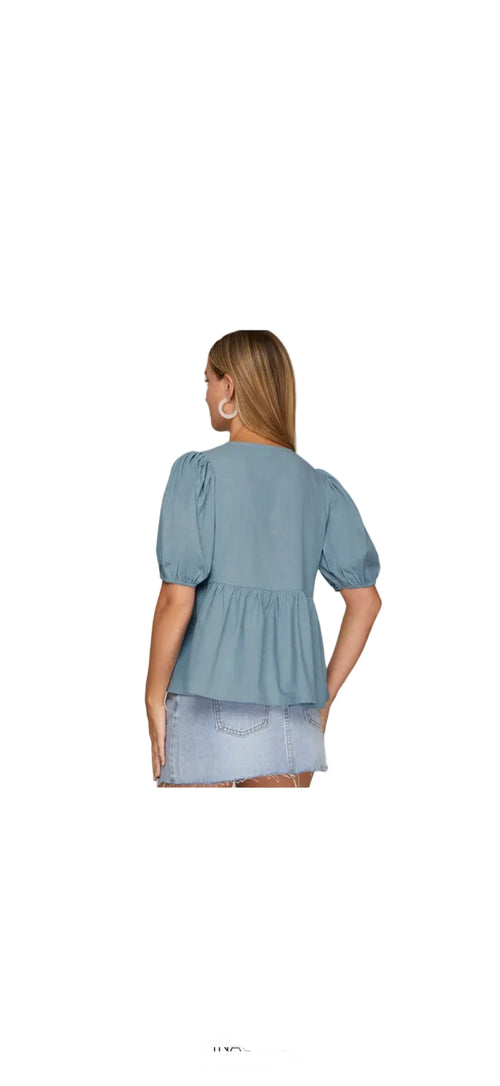 Blue tie front puff sleeve shirt back view